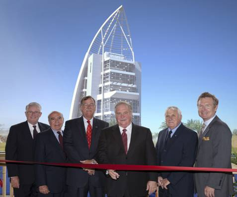 Pictured above from left are Canaveral Port Authority Commissioners Jerry Allender (Secretary/Treasurer); Frank Sullivan; Tom Weinberg (Vice Chairman); Bruce Deardoff (Chairman) and Joe Matheny, along with Port Canaveral CEO Stan Payne. In the background is a rendering of the $21 million, seven-story Welcome Center scheduled to be completed by July 2013. The ribbon-cutting officially opens the public viewing platform that will allow visitors to monitor the progress of construction.