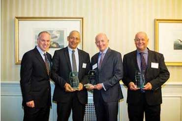 Norwegian Cruise Line’s Superintendent of Safety and Training Development, Rick Harper (far right), accepts the 2012 Quality Ship Management Award from American Maritime Safety 