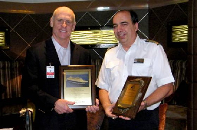 Tampa Port Authority Chairman William “Hoe” Brown and vessel Capt. Werner Timmers enjoy a plaque exchange on board m/s Ryndam