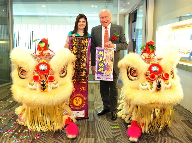 Neeta Lachmandas, Assistant Chief Executive, Singapore Tourism Board and Pier Luigi Foschi, Chairman & Chief Executive Officer, Carnival Asia receiving the prosperity scrolls at the official opening of the Carnival Asia regional office.