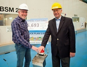 Kevin Sheehan, chief executive officer of Norwegian Cruise Line, and Bernard Meyer, managing director of MEYER WERFT, press the button to start the first steel cutting for Norwegian Escape.