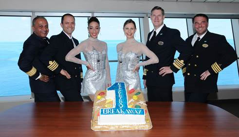 Norwegian Breakaway’s Godmothers, The Rockettes (center), along with the ship’s Captain Hakan Svedung (center right) and Four Stripe officers (from L to R, Hotel Director Prem  Kainikkara, Staff Captain Matko Candrlic and Chief Engineer Zoran Posa) mark one year of  sailing from Manhattan