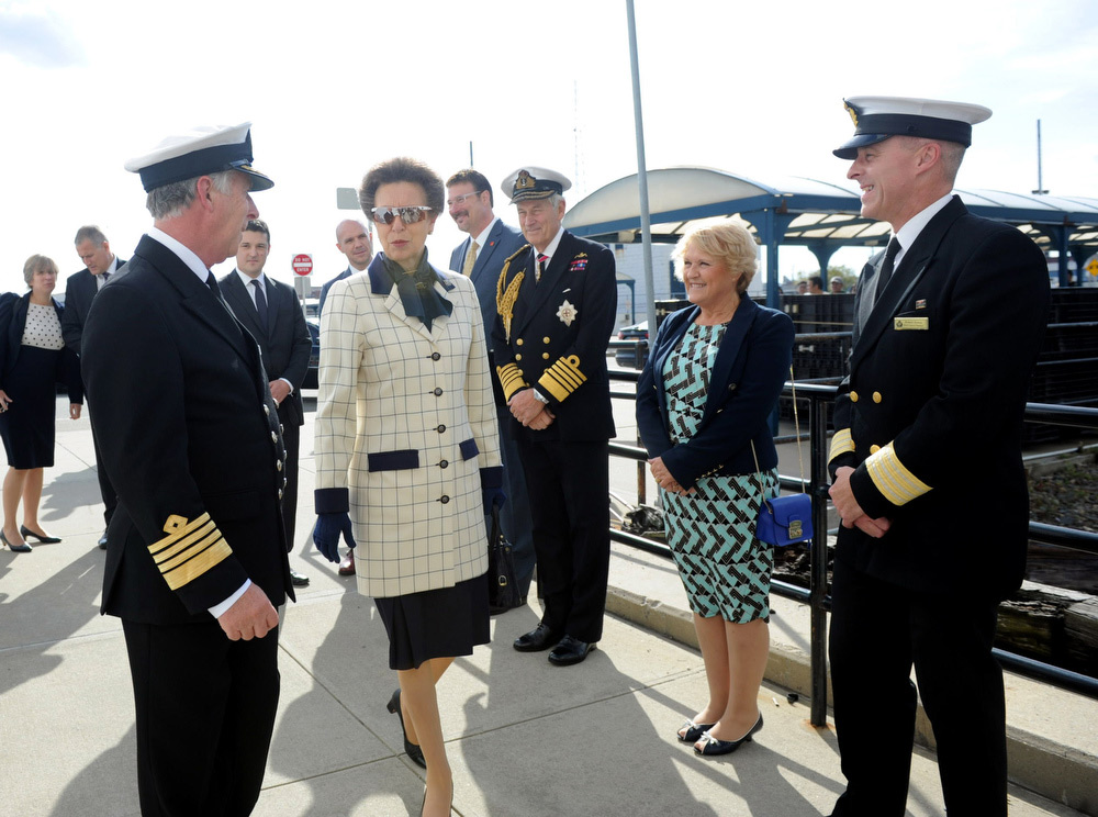 Queen Mary 2 Captain Kevin Oprey, left, greets HRH Princess Anne, patron of the National Museum of the Royal Navy (NMRN), at the Brooklyn Cruise Terminal in New York.  Joining them are Richard Meadows, president, Cunard North America, Admiral of the Fleet the Lord Boyce, Cheryl Oprey and the ship's Hotel Manager Robert Howie. (Photo by Diane Bondareff/AP Images for Cunard)