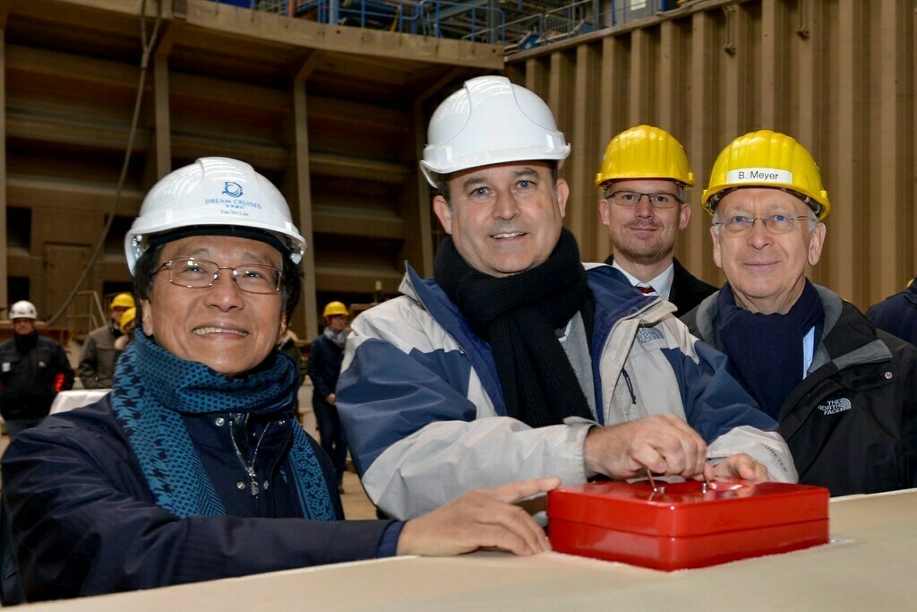 (L to R)  Tan Sri Lim Kok Thay (Chairman and CEO, Genting Hong Kong), Thatcher Brown (President, Dream Cruises), Henning Stellermann (Project Manager, Meyer Werft) and Bernard Meyer (CEO, Meyer Werft) with the traditional lucky coins