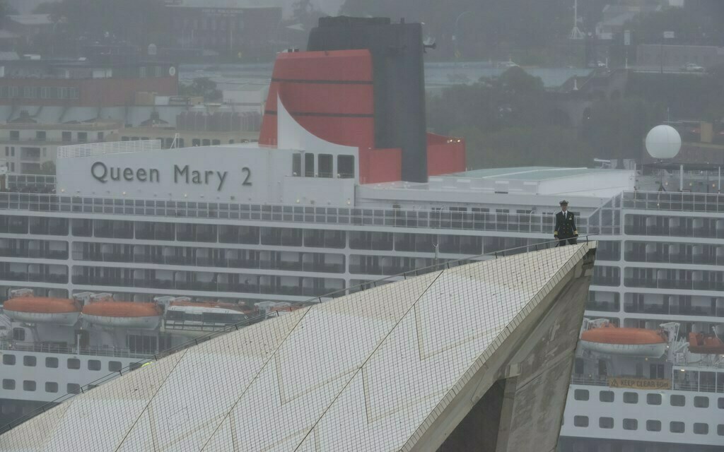 Queen Mary 2 Captain Christopher Wells had the best seat in the house in Sydney today, taking in the view of his ship and her sister Queen Elizabeth from the sails of the Sydney Opera House, following the two Queens’ arrival in the city for a Royal Rendezvous.  Photo: James Morgan