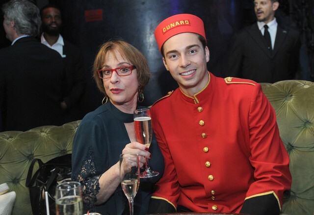 Patti LuPone enjoys a glass of champagne alongside Cunard bellman