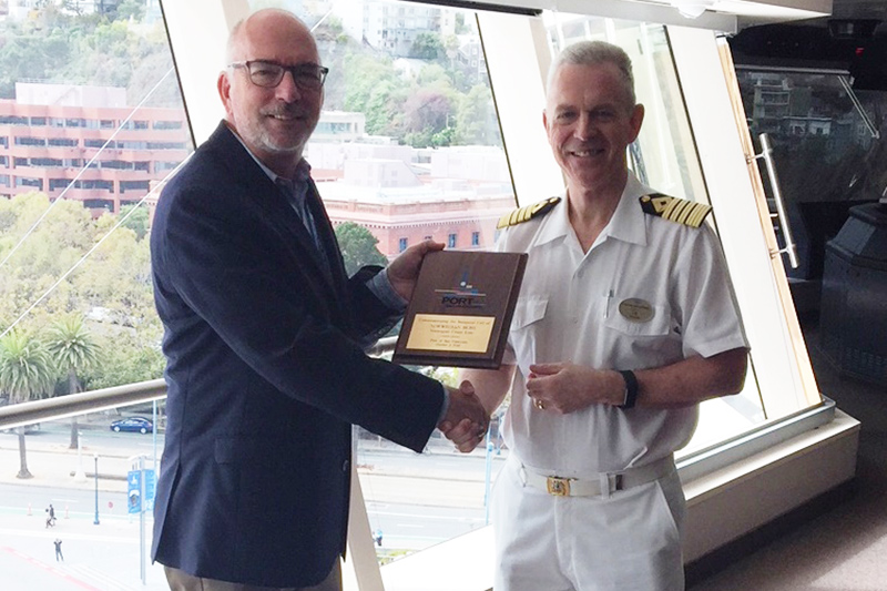 Port of San Francisco Maritime Director Peter Dailey presents a plaque to Captain Steffan Bengtsson of Norwegian Bliss.