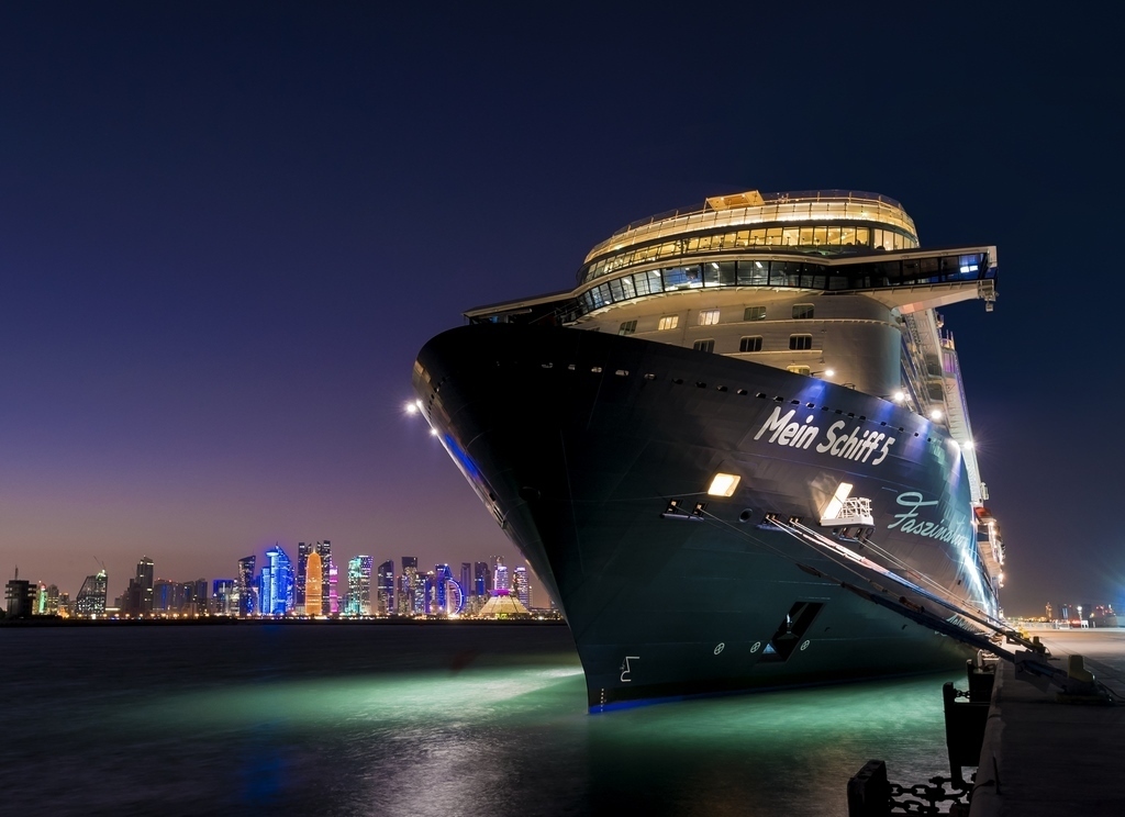 Mein Schiff 5 in Doha at night