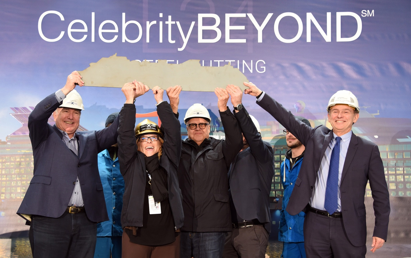 Royal Caribbean Cruises Ltd. and Chantiers de l’Atlantique executives raising the signed commemorative ship cut-out at the ceremonial steel-cutting for Celebrity Beyond, coming fall 2021. (From left to right: Richard D. Fain, Chairman and CEO, RCCL; Lisa Lutoff-Perlo, President and CEO, Celebrity Cruises; Harri Kulovaara, Executive Vice President, Maritime and Newbuilding, RCCL; and Laurent Castaing, General Manager, Chantiers de l’Atlantique)